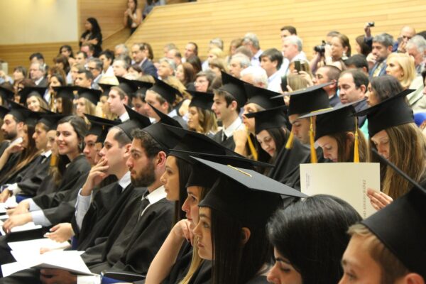 College students at graduation ceremony.