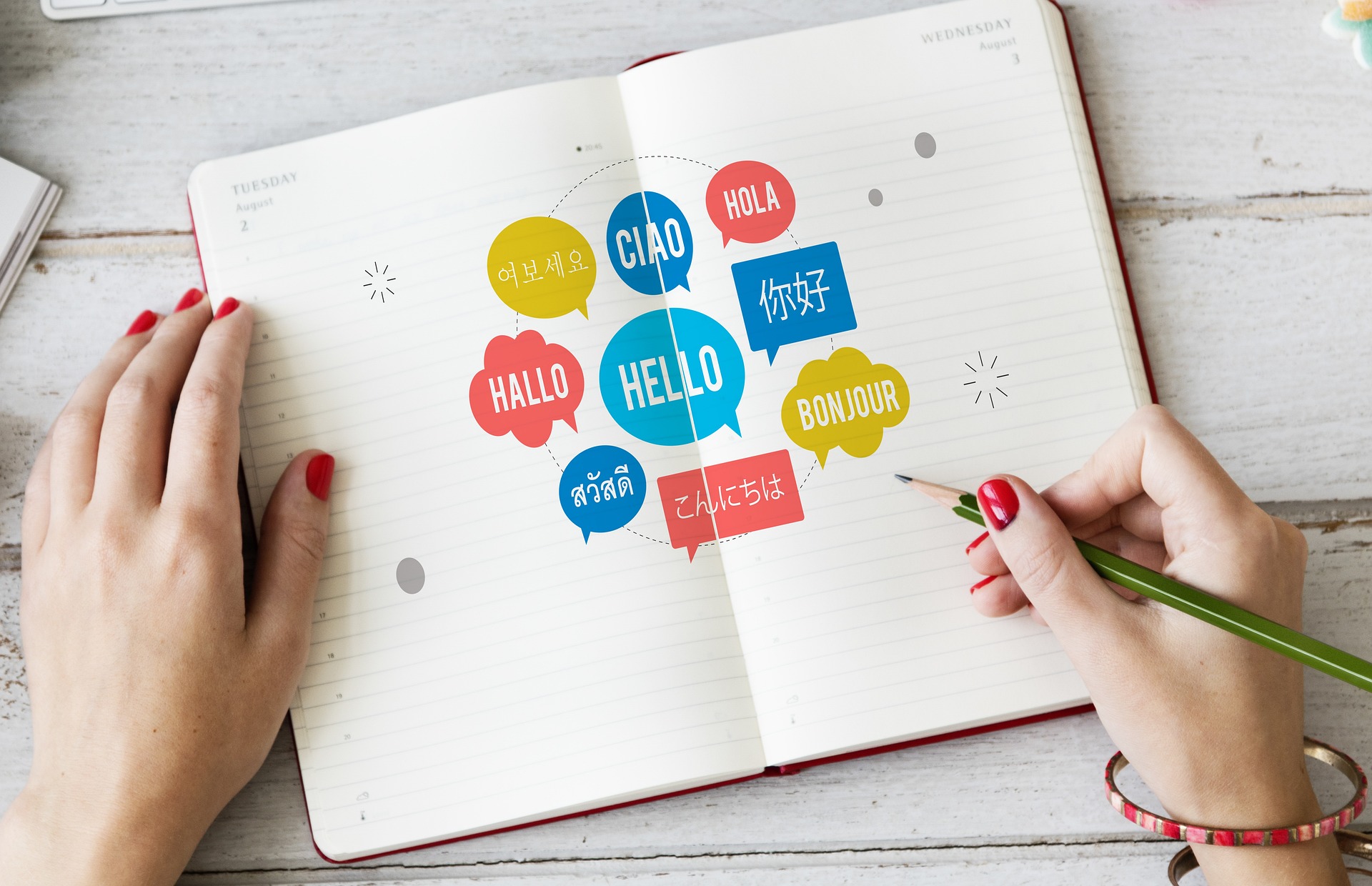 A woman engaged in writing, filling her notebook with the word "hello" in different languages, symbolizing her passion for language.