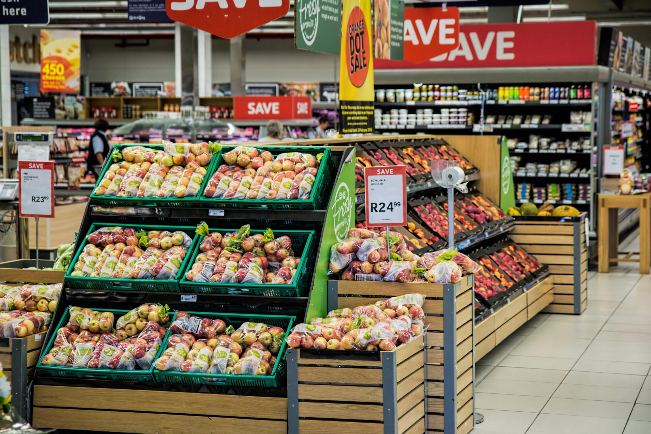 A well-stocked store featuring a diverse selection of fresh fruits, vegetables, and additional grocery items for sale.