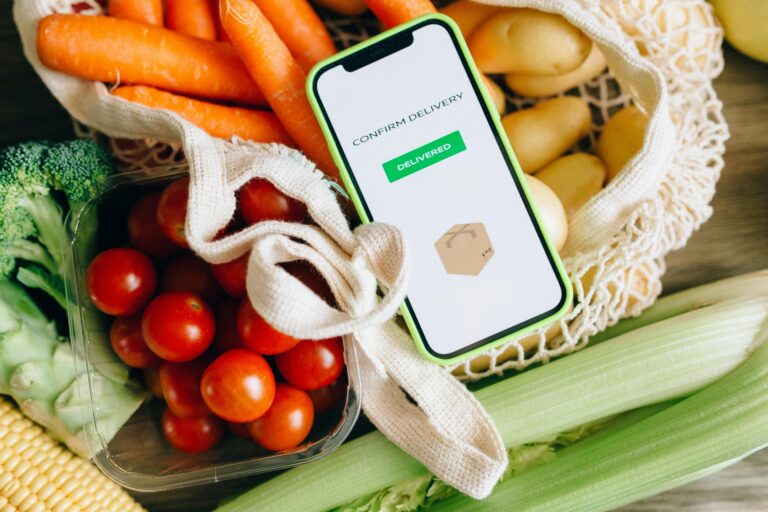 A close-up of a smartphone displaying a grocery shopping app, illustrating modern shopping convenience.